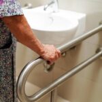Handrail safety grab bar near a wash basin