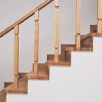Wooden staircase in a residential home suitable for custom stairlift measurement at Lancaster Mobility
